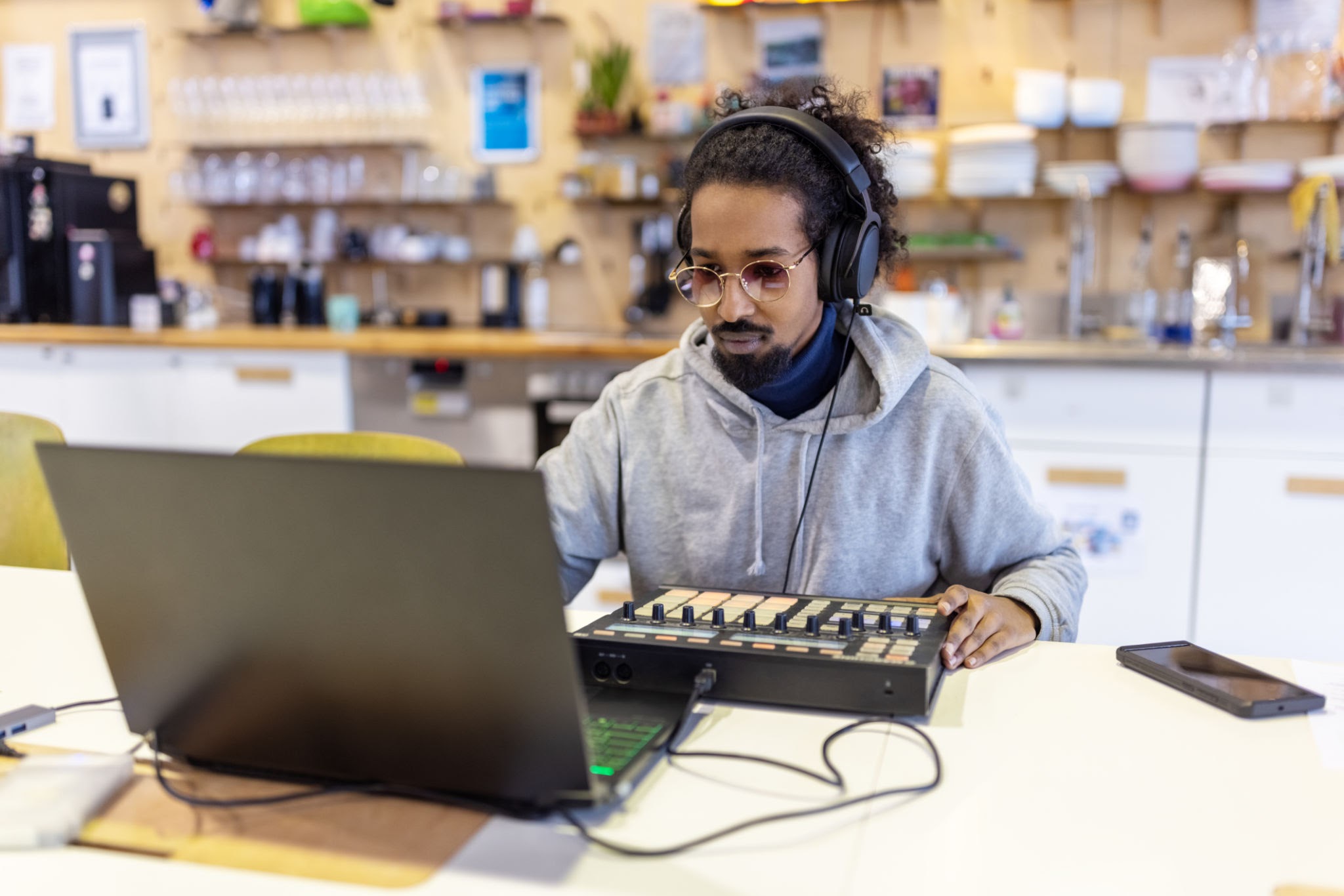 Music producer working at a mixing console in a recording studio