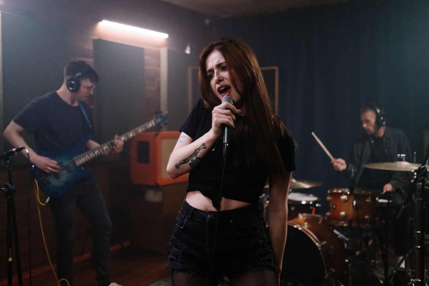 Musicians rehearsing together in a music studio